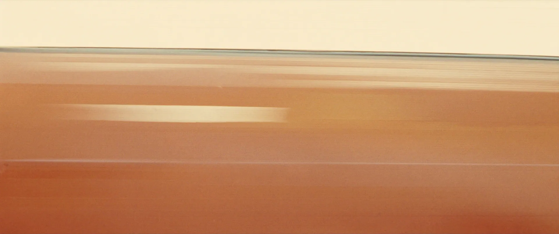Soft amber bands of sunlit shade cloth